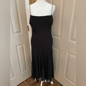 Brioche lined polyester chiffon high low spaghetti strap little black dress. 11